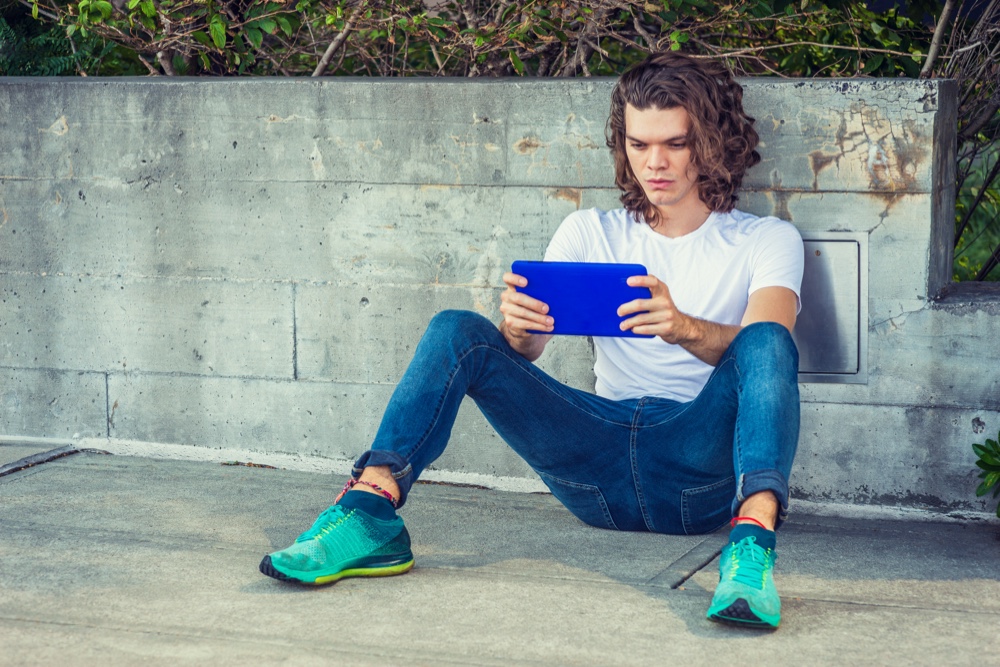 Man Colorful Sneakers Sitting Street