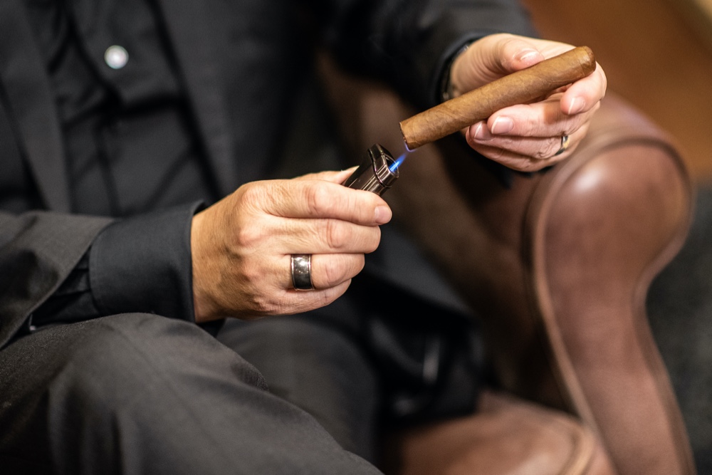 Man Lighting Cigar Man Lighting Cigar