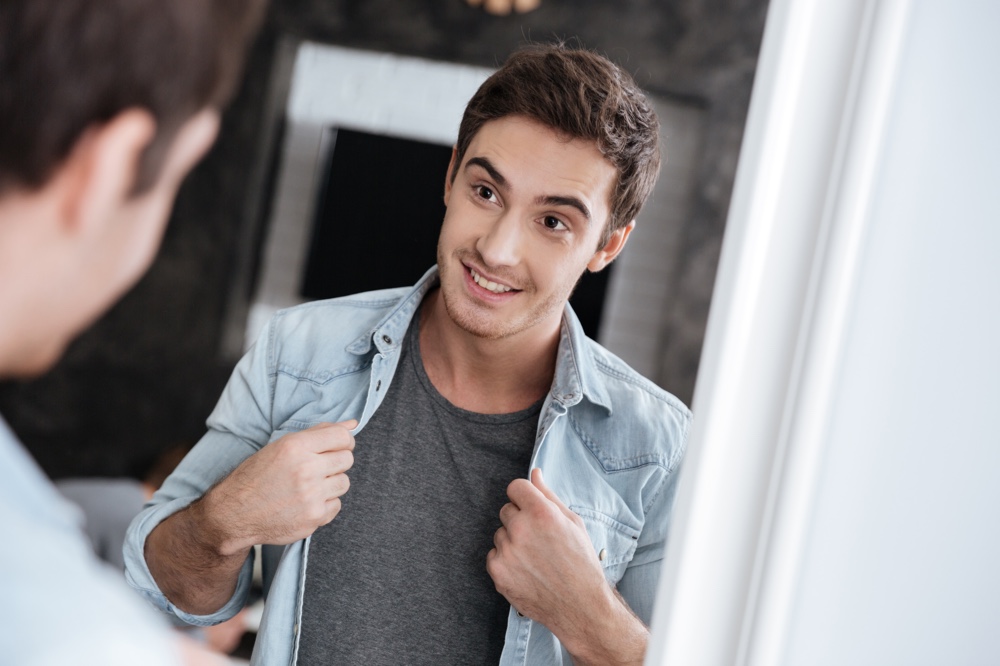 Man Looking in Mirror