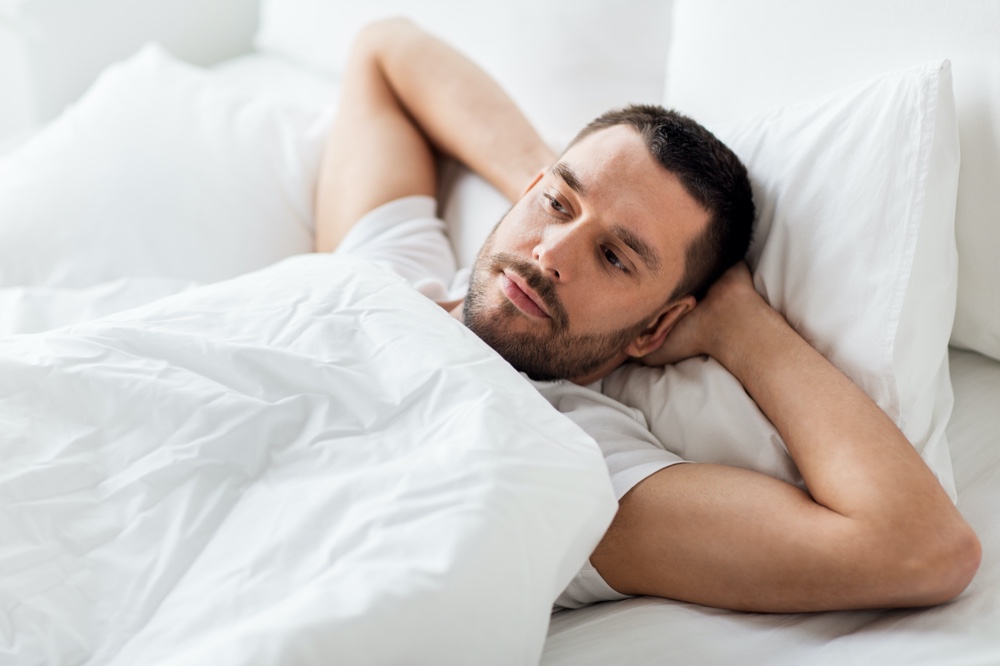 Man Resting in Bed