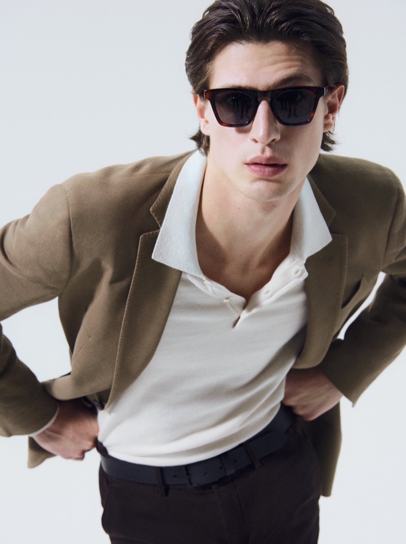 Leaning into the camera, Edoardo Sebastianelli wears sunglasses and is a sleek vision in Massimo Dutti.