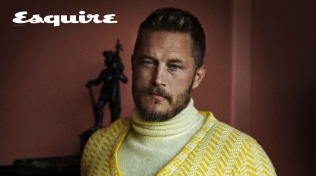 Embracing yellow, Travis Fimmel dons a turtleneck and sweater from Prada with a Tod's belt and pants for Esquire Kazakhstan.