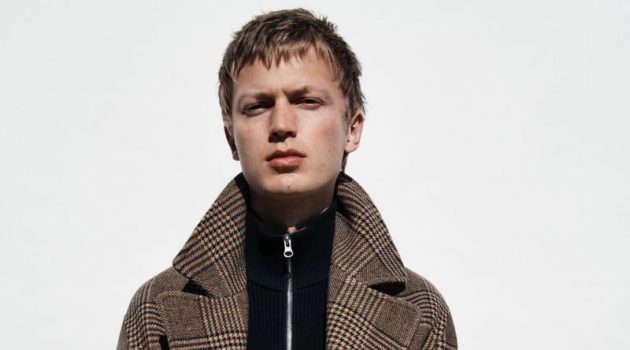 Working Man: Jonas Dons Modern Workwear for Zara In front and center, Jonas Glöer models a double-breasted plaid coat from Zara.