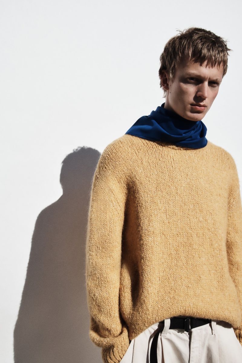 Jonas Glöer models a textured sweater from Zara.