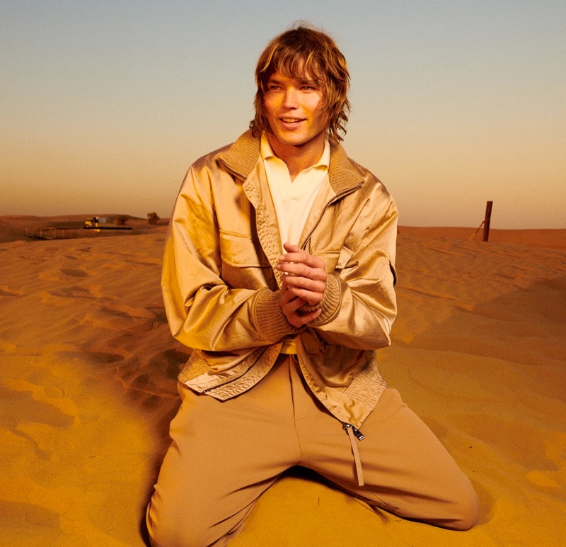 Jordan Barrett is all smiles in a camel-colored BOSS number.