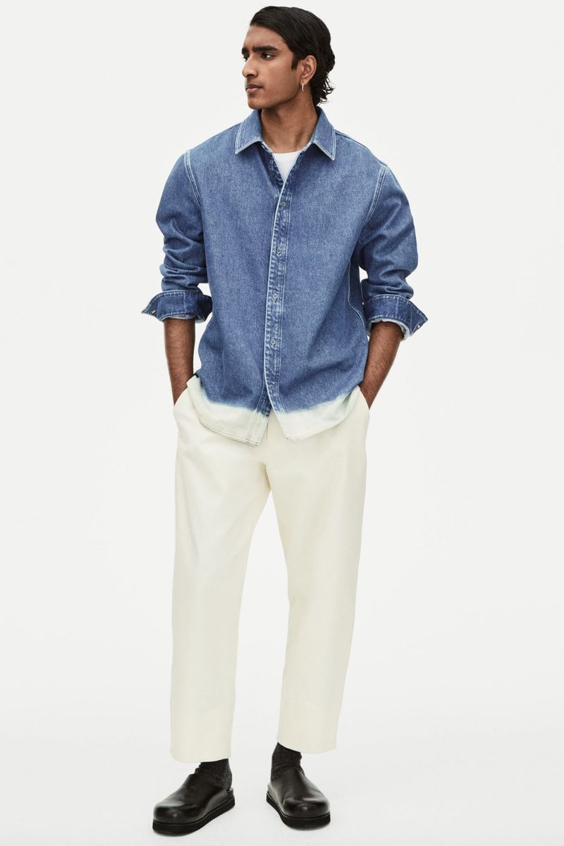Double down on denim by pairing white jeans with a classic blue denim shirt.