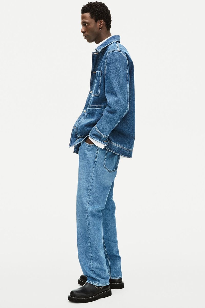 Cherif Douamba double down on denim, wearing a workwear-inspired look for COS' spring 2022 denim campaign.