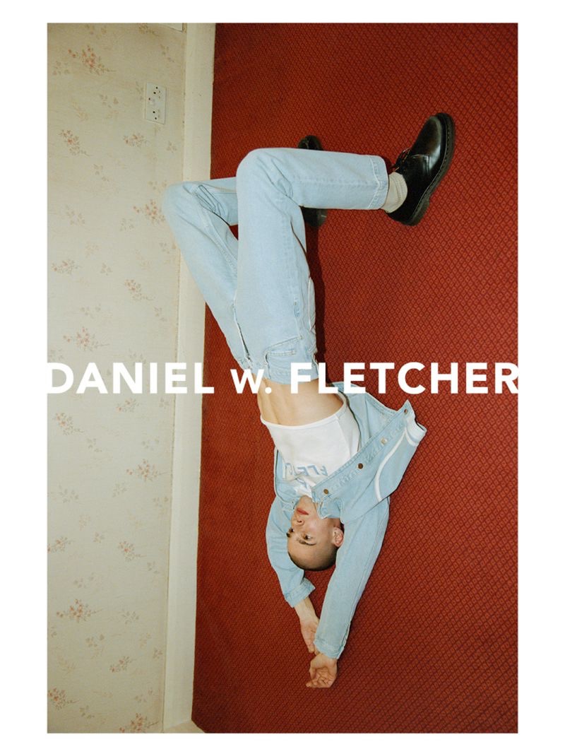 Model Patryk Lawry wears light wash denim for Daniel W. Fletcher's spring-summer 2022 campaign.