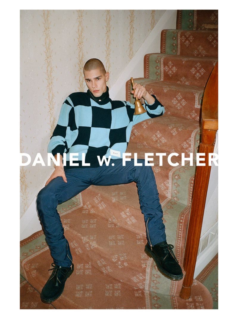 Making a graphic statement in a checker print sweater, Patryk Lawry fronts Daniel W. Fletcher's spring-summer 2022 campaign.