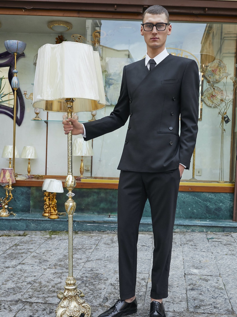 Vik Wildemeersch dons black framed glasses and a dapper suit for Dolce & Gabbana's spring-summer 2022 men's campaign.