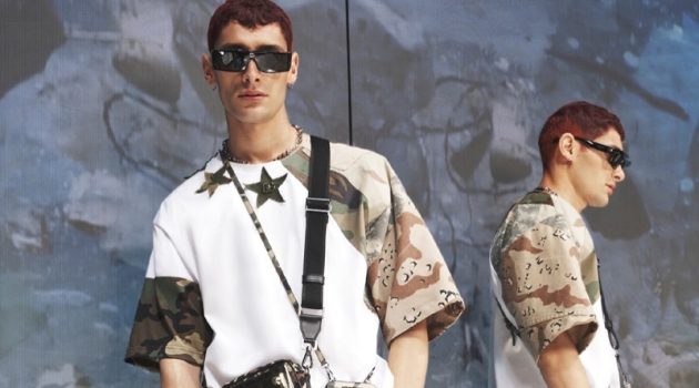 Dolce & Gabbana Tackles Camouflage with Reborn to Live Collection Nicolò Verde is a cool vision in a relaxed camouflage t-shirt from Dolce & Gabbana's spring-summer 2022 men's Reborn to Live collection.