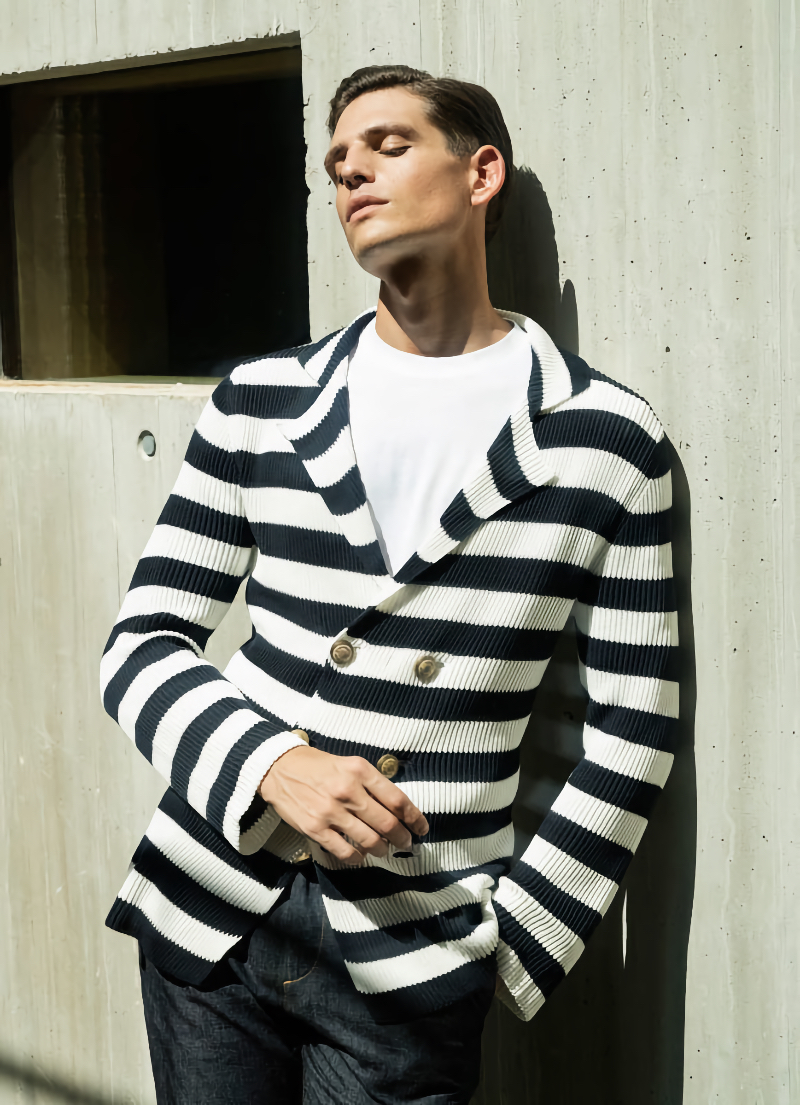 A divine vision in a striped knit double-breasted blazer, Pau Ramis fronts the spring-summer 2022 campaign for Eleventy Milano.
