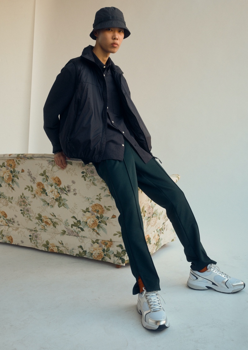 Embracing casual style, Jihoon Choi slips in a pair of sneakers from H&M's Essentials collection.