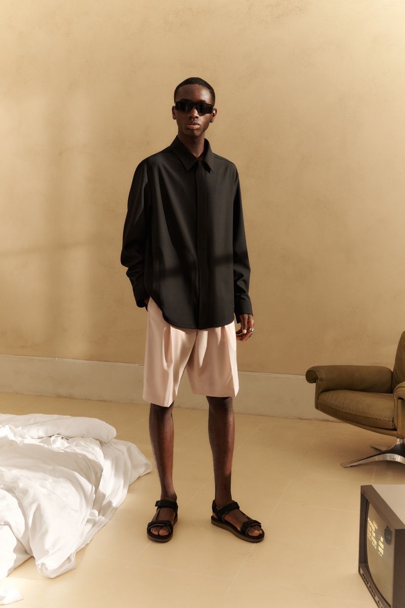 Embracing clean, relaxed shapes, Jonathan Tidika dons a spring 2022 look from HUGO.