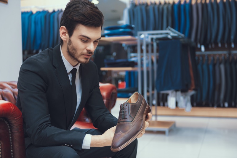 Man Holding Oxford Brogue Shoes Brown Store