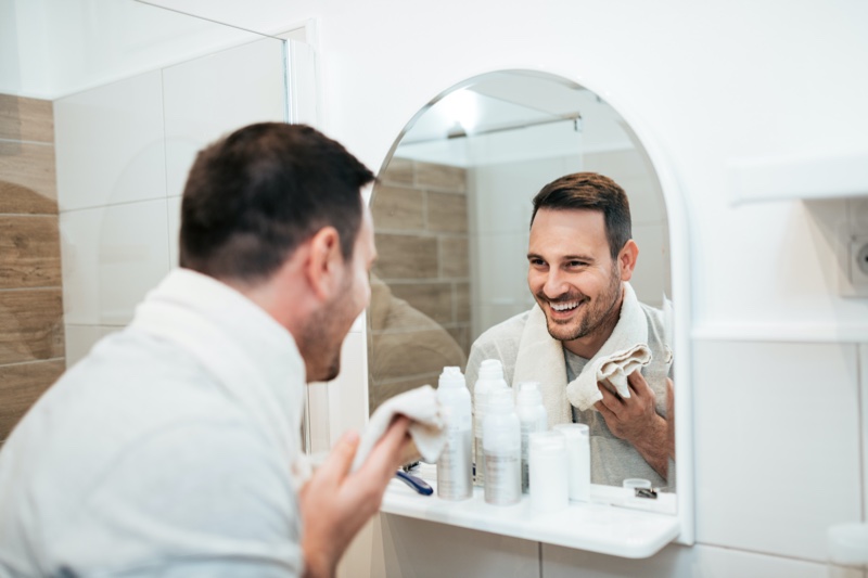 Man Smiling Skincare Routine Bathroom