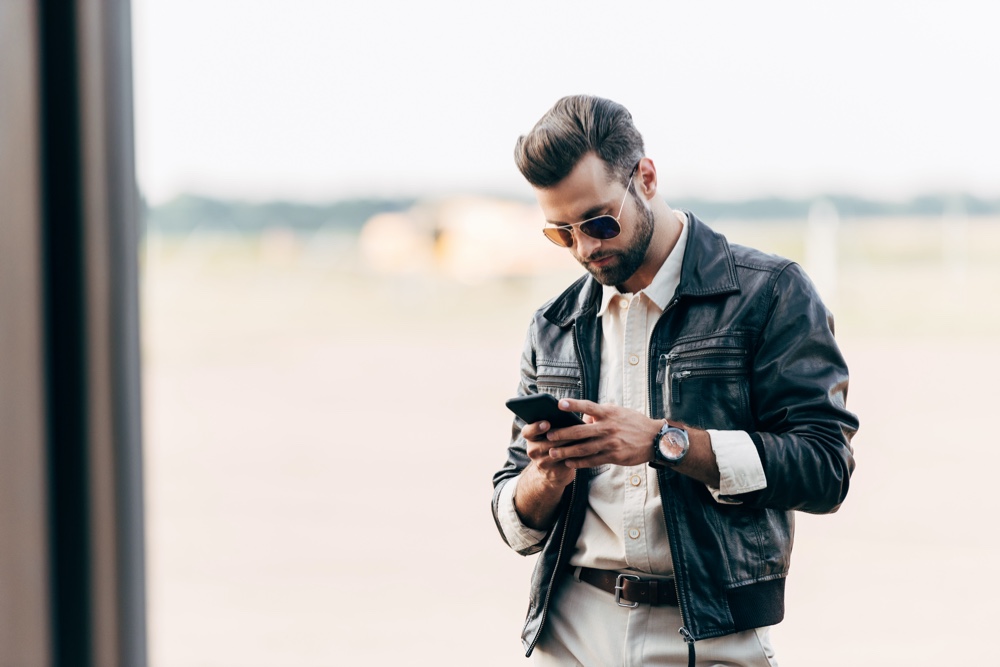 Man Wearing Aviator Sunglasses and Leather Jacket