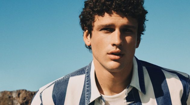 Simon Nessman Goes Casual for Mango Spring '22 Denim Campaign Simon Nessman wears a striped denim shirt for Mango Man's spring-summer 2022 denim campaign.