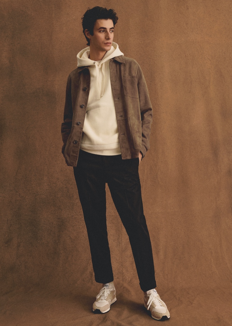 Oscar Kindelan dons a brown suede jacket over a hoodie from Mango Man.