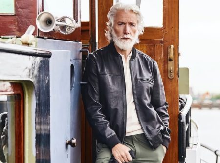 Aiden Brady wears a leather jacket with cargo pants from Mey & Edlich's spring 2022 offering for men.