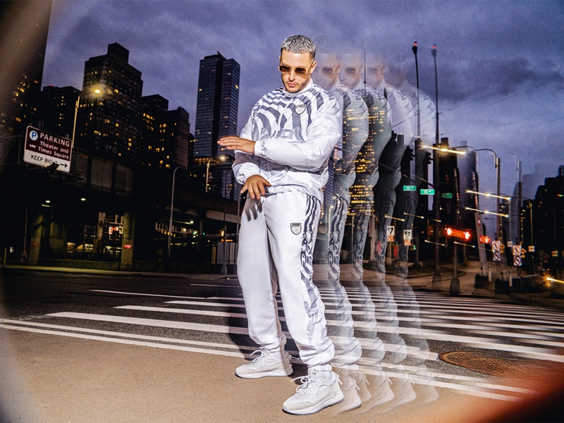 Taking up the spotlight, DJ Snake wears his PUMA Mirage Sport sneakers.