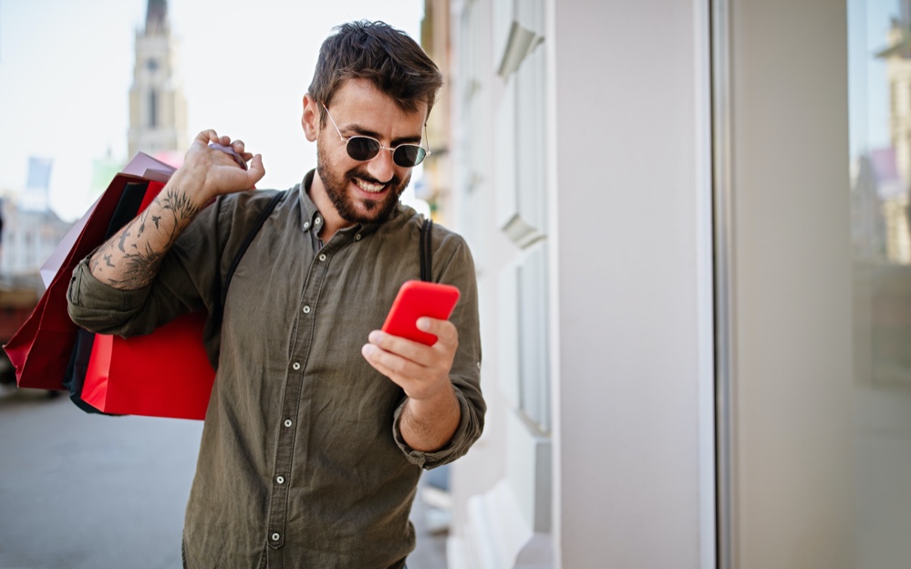 Stylish Man on Phone Shopping Bags