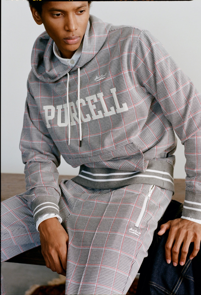 Going casual, Rafael Mieses wears a Todd Snyder x Converse Jack Purcell plaid hoodie.