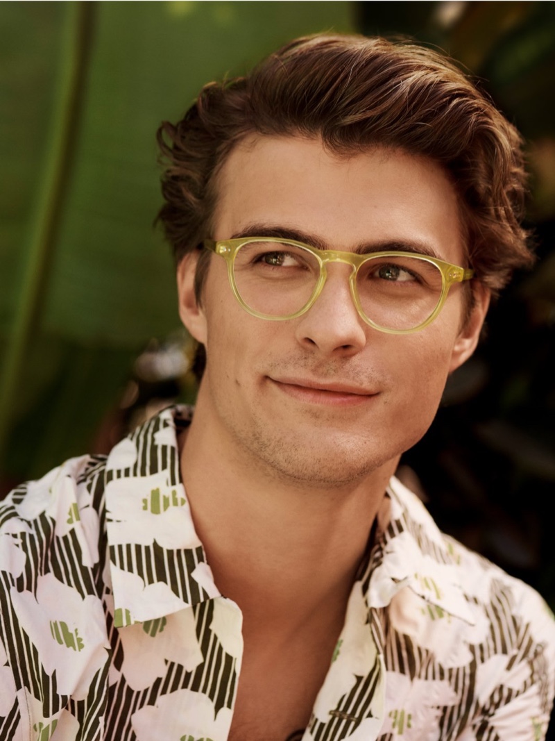 Brett Robinson sports Warby Parker Waller glasses in Plantain Crystal.