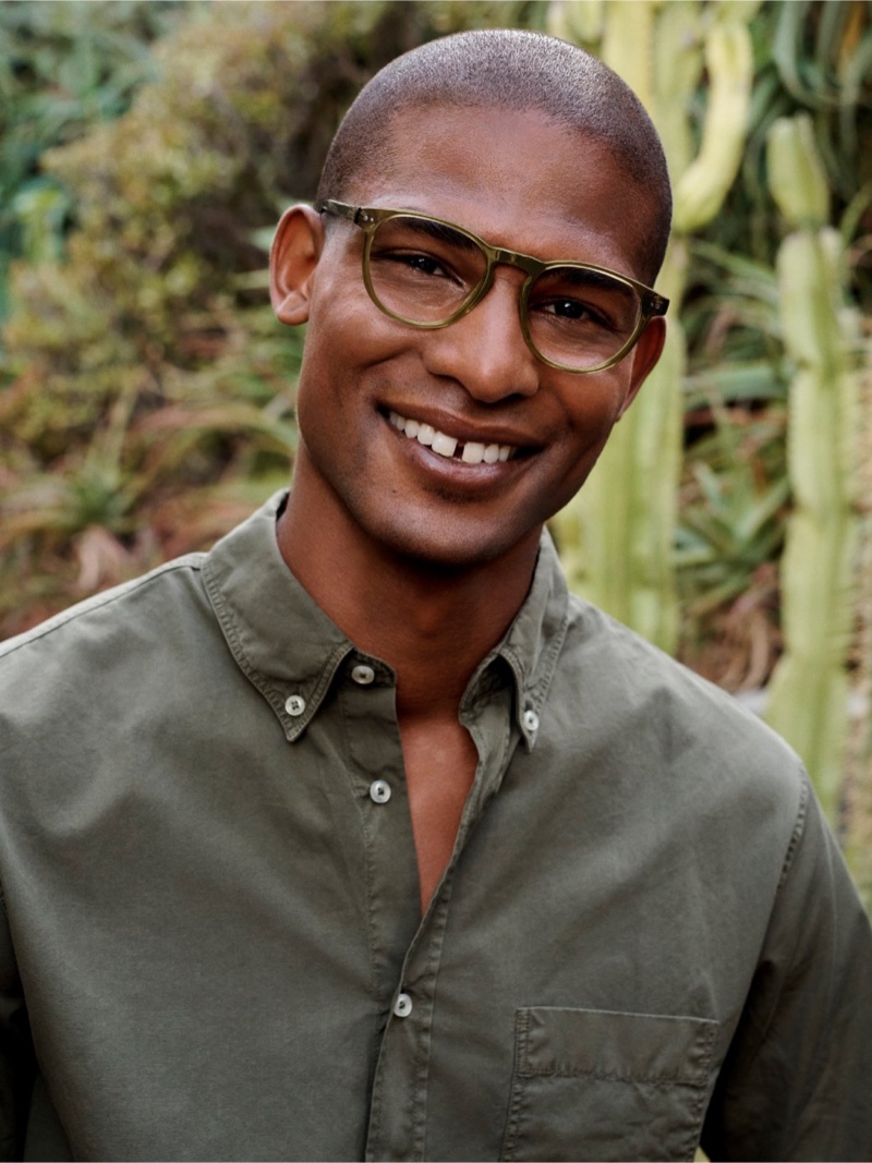 Vince Harrington wears Warby Parker Waller glasses in Cactus Crystal.