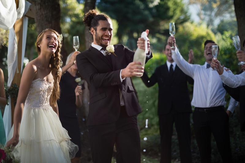 Bride Groom Opening Champagne Wedding