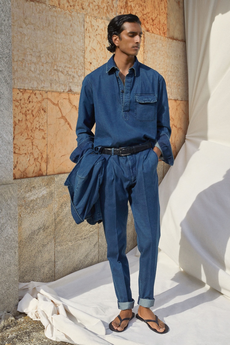 Showing Brioni's more casual side, Jeenu Mahadevan wears denim from the brand's spring-summer 2022 collection.
