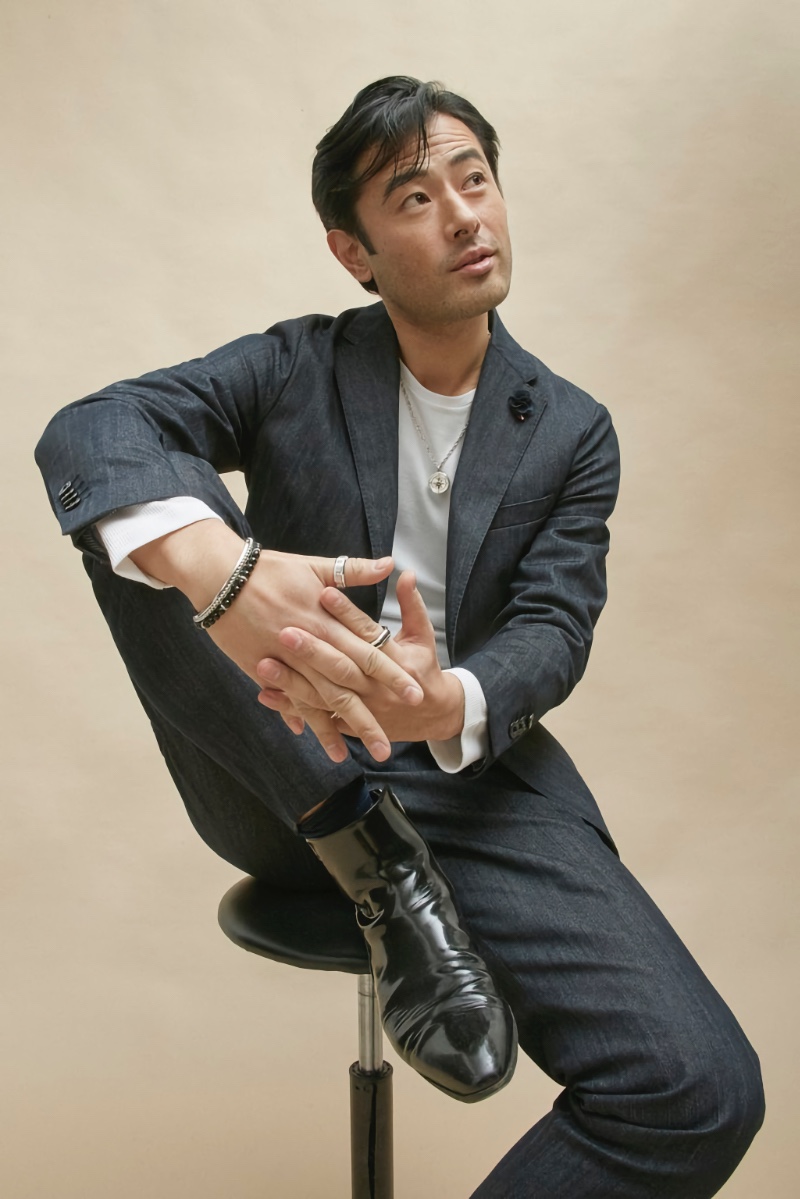 Yusuke Ogasawara wears a Tommy Hilfiger suit with Gabriel & Co. jewelry. 