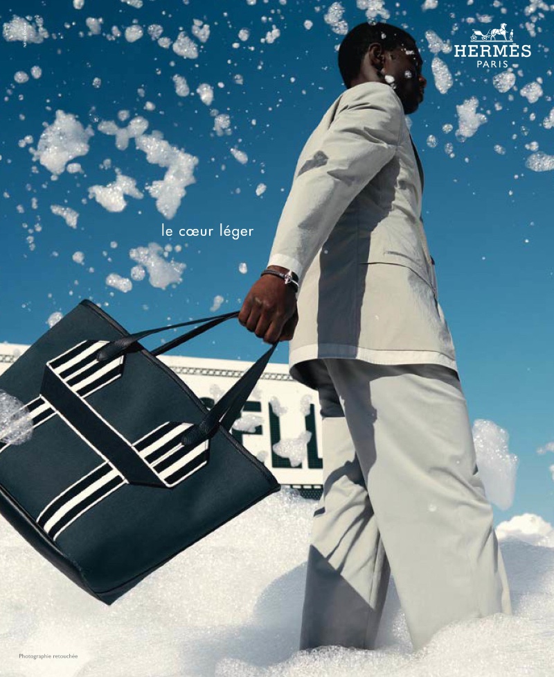 Cheikh Dia appears in Hermès' spring-summer 2022 men's campaign.