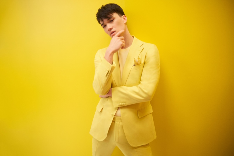 Indochino delivers an impactful punch of color for spring-summer 2022 with Stephen Allen modeling a yellow suit for the brand.