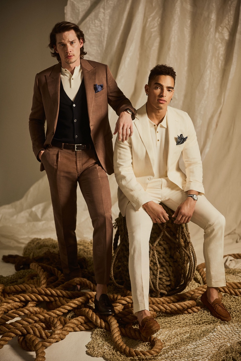 Embracing neutral tones, Joey Kirchner and Justin Lyons model Indochino suits from the brand's spring-summer 2022 collection.