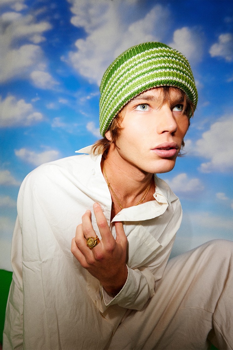 A laid-back vision, Jordan Barrett rocks a green striped beanie from his Lack of Color collaboration.