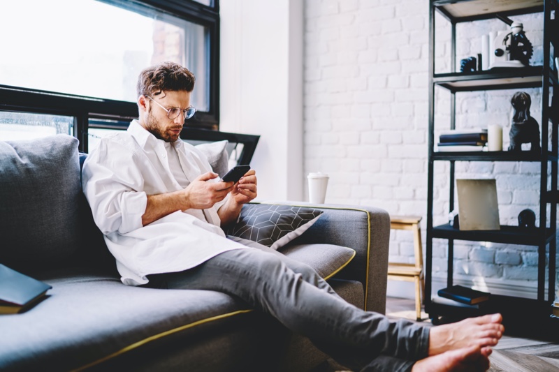 Man Relaxing at Home Glasses Oversized White Shirt Man Relaxing at Home Glasses Oversized White Shirt