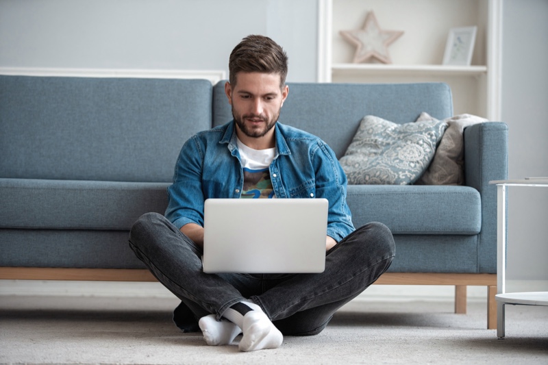 Man on Laptop Living Room