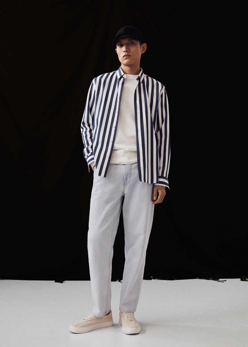 Zhang Wenhui wears a striped shirt with light wash denim jeans from Mango Man.