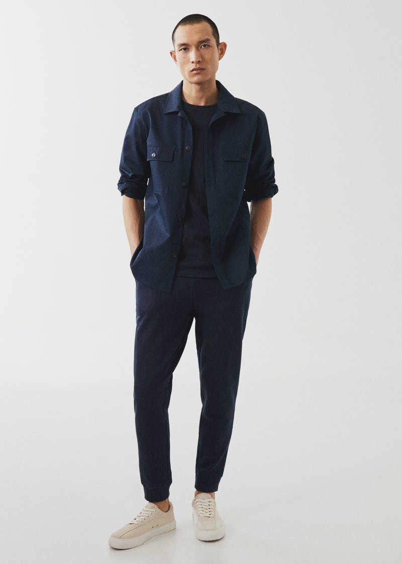 Embracing monochrome style, Zhang Wenhui sports a navy Mango Man look.