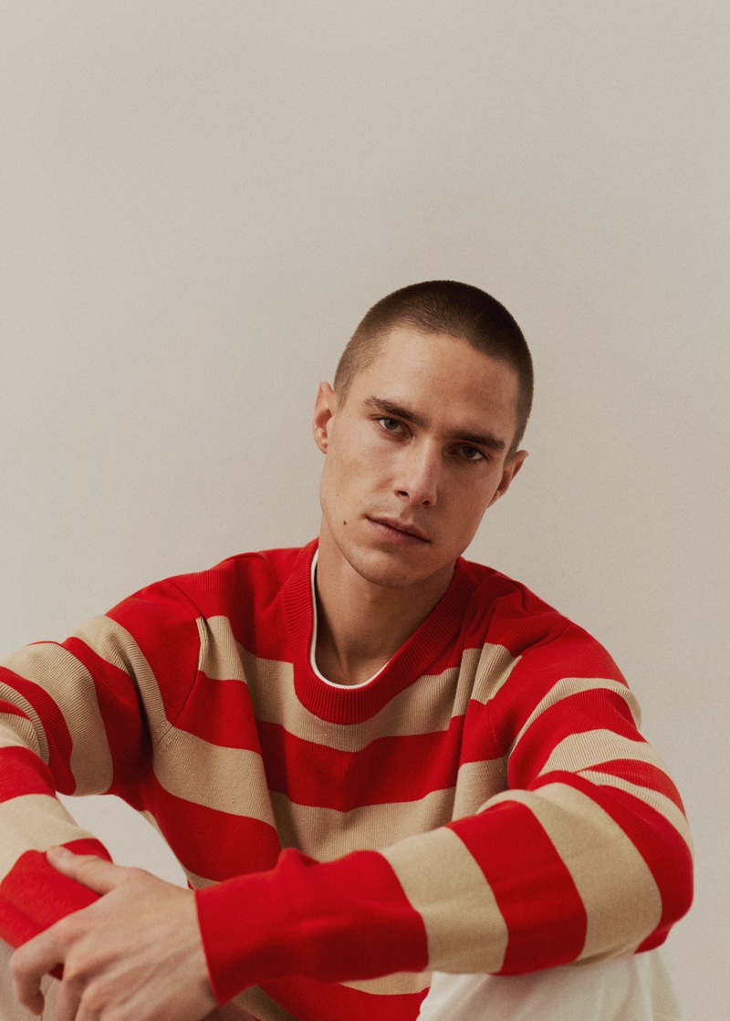 Going casual, Jeff Hinton wears an orange striped sweater from Mango Man.