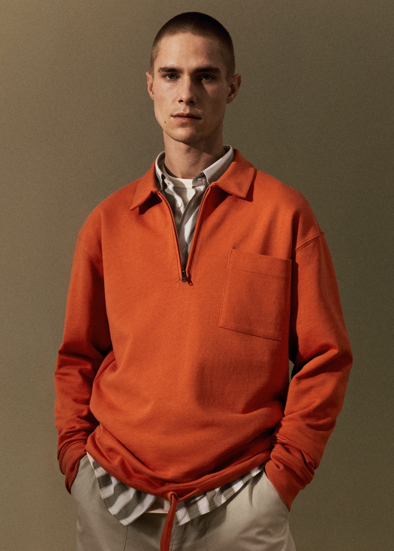 Jeff Hinton models an orange quarter-zip pullover from Mango Man.