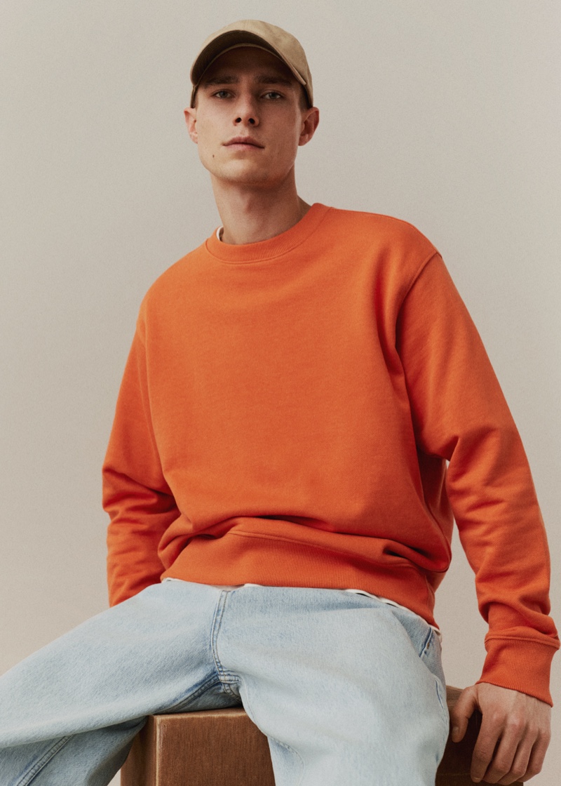 Taking up the spotlight for spring, Jeff Hinton sports an orange sweatshirt by Mango Man.