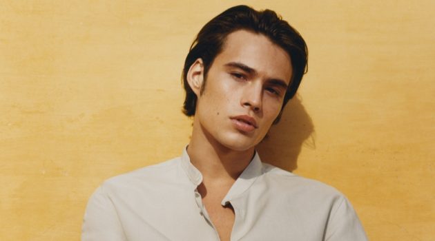 Louis Baines Embraces a 'Relaxed Confidence' in Mango Embracing smart-casual style, Louis Baines models a band-collar long-sleeve shirt with shorts from Mango Man.