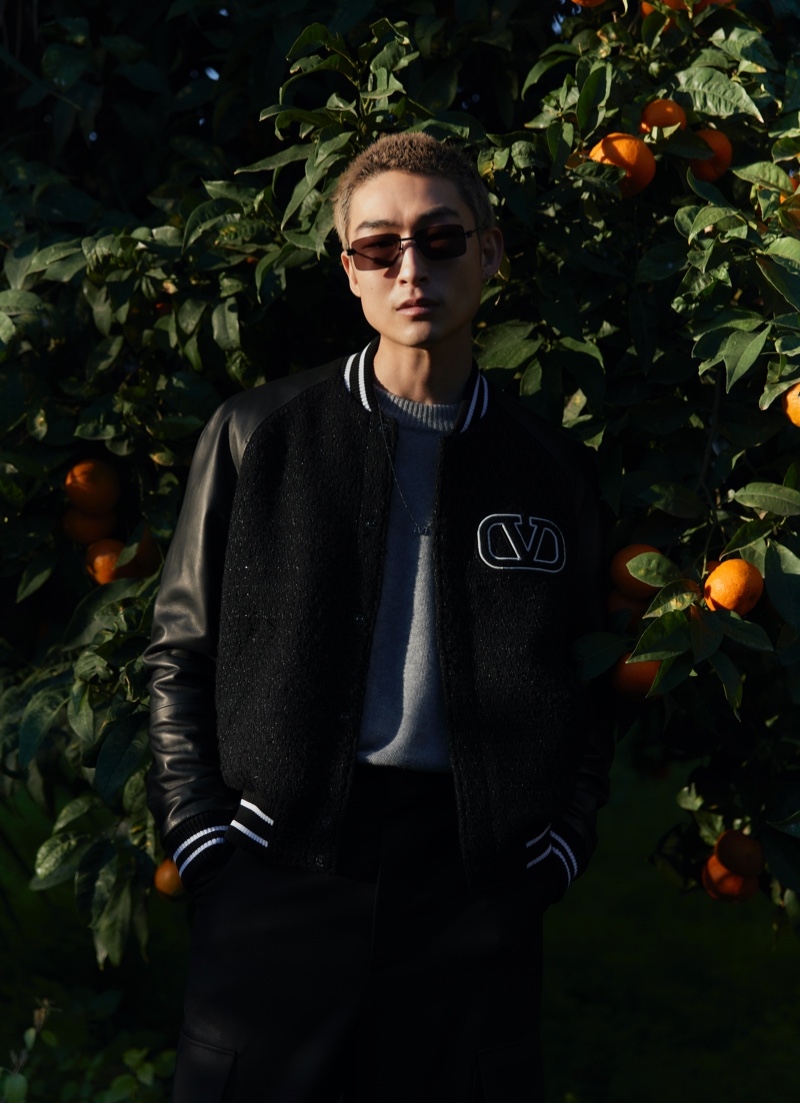 Sang Woo Kim is a cool vision in a Valentino varsity jacket for Mytheresa's new men's campaign.