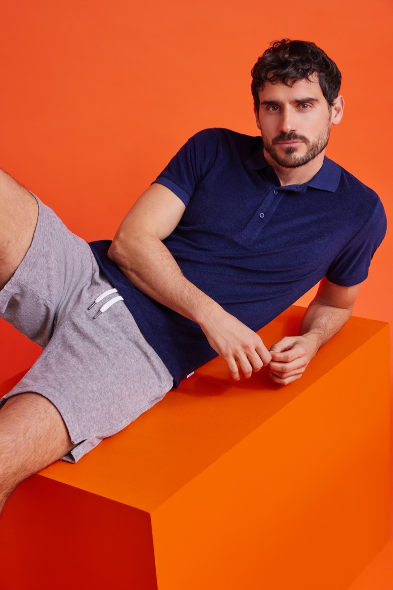 Arthur Kulkov wears a towel terry polo and shorts from Onia.