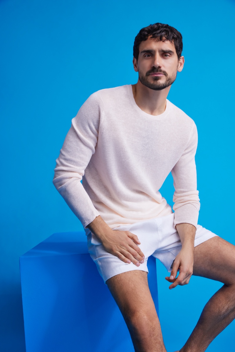 Embracing light hues, Arthur Kulkov stands out in a relaxed beach look by Onia.