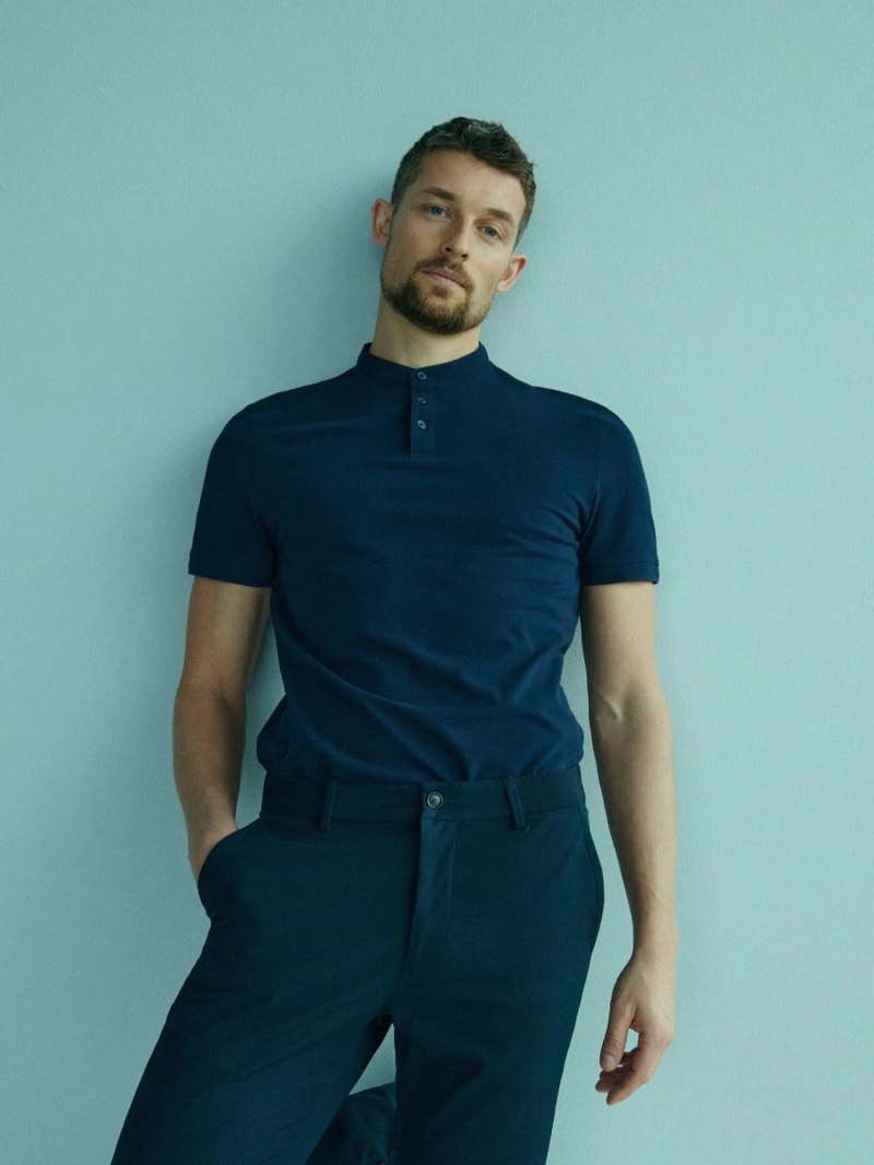 Wouter Peelen showcases monochrome style in a navy collarless polo and trousers from Reserved.