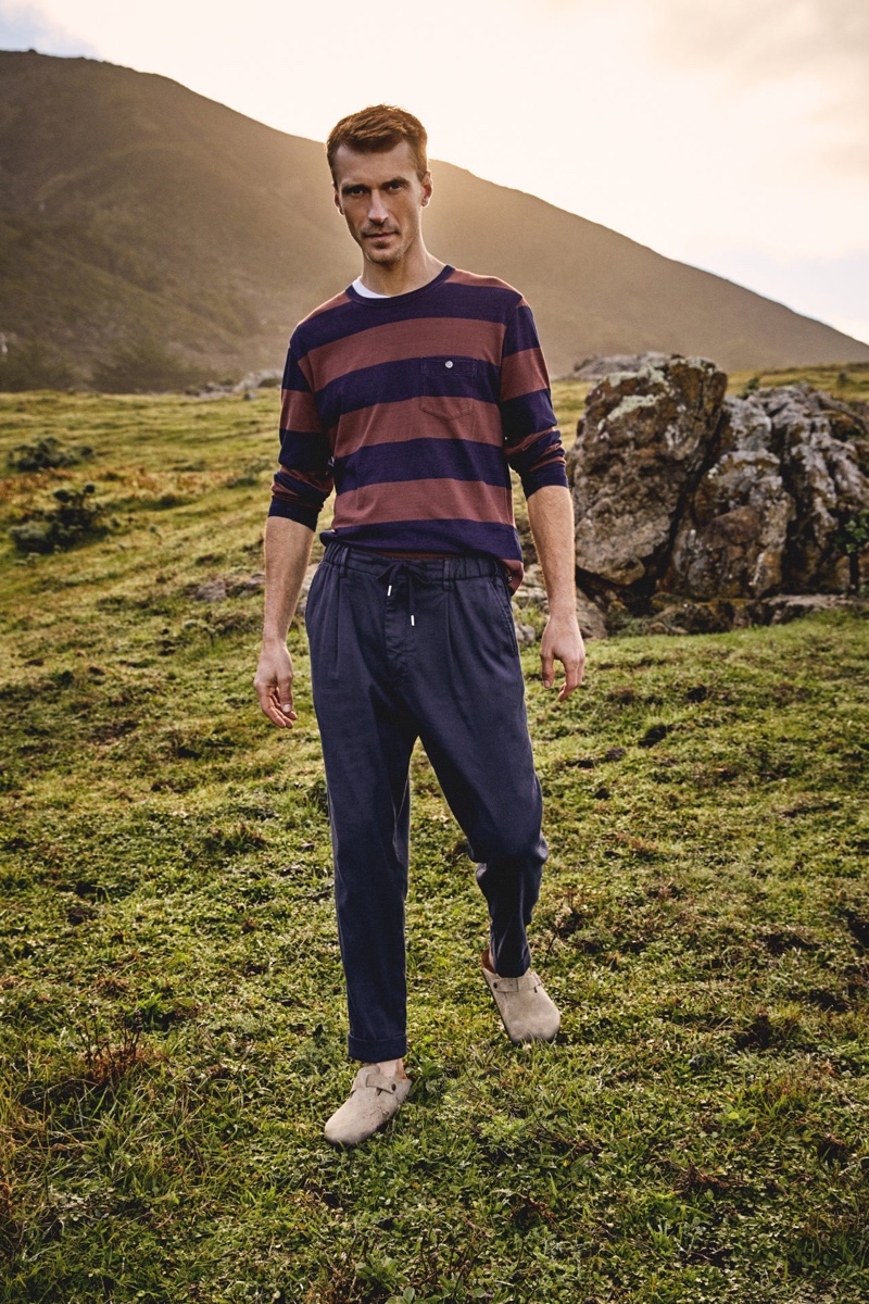 Stepping outdoors, Clément Chabernaud wears a Todd Snyder wide stripe tee, Italian cotton-linen Traveler trousers, and Birkenstock Boston clogs.