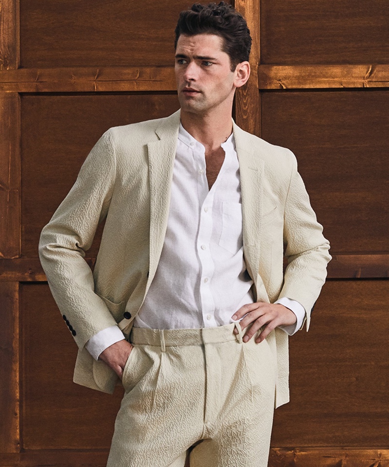 Embracing spring style, Sean O'Pry charms in Todd Snyder's Italian seersucker Traveler suit in stone.